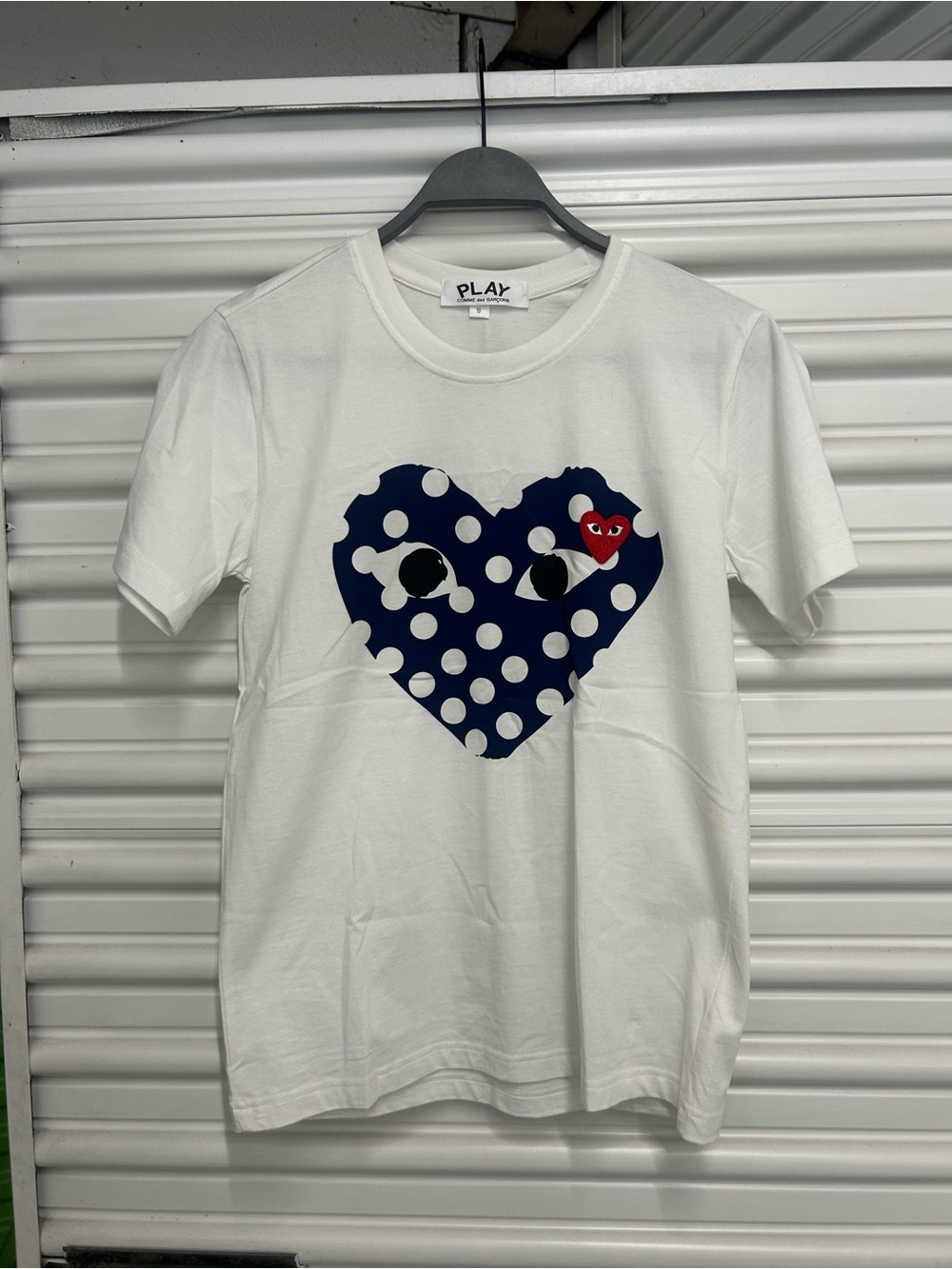 Comme des Garçons PLAY White Tee with Navy Polka Dot Heart and Red Heart Accent